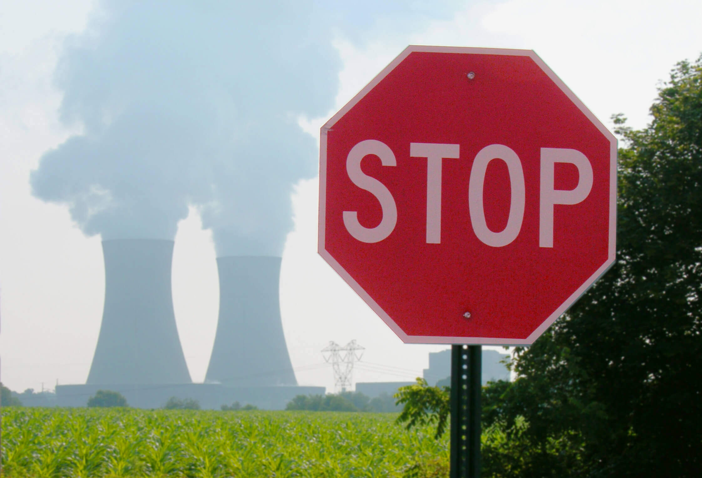 an engineer standing in front of a nuclear power plant